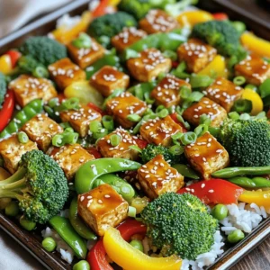 For this dish, you will need the following main ingredients: - 1 block (14 oz) firm tofu, pressed and cubed - 2 cups broccoli florets - 1 red bell pepper, sliced - 1 yellow bell pepper, sliced - 1 cup snap peas - 2 tablespoons olive oil - 1/4 cup teriyaki sauce (store-bought or homemade) - Salt and pepper to taste These ingredients come together to create a colorful and tasty meal. The firm tofu gives a hearty feel, while the veggies add crunch and flavor. You can enhance your Teriyaki Tofu & Veggies with these optional toppings: - 1 tablespoon sesame seeds - 2 green onions, chopped - Cooked rice or quinoa for serving Using rice or quinoa as a base makes this dish filling. The sesame seeds and green onions add a nice touch on top. To make this dish, gather these tools: - A large mixing bowl - A large baking sheet - Parchment paper - A spatula for tossing Having these tools ready streamlines the cooking process. The parchment paper makes cleanup easy and prevents sticking. Start by pressing the tofu. This step removes excess water. Wrap the tofu block in a clean towel. Place a heavy object on top. Let it sit for about 15 minutes. This helps the tofu absorb flavors better. After pressing, cut the tofu into cubes. In a bowl, mix the cubed tofu with olive oil, half of the teriyaki sauce, salt, and pepper. Toss until each piece is coated well. This adds taste and helps it brown nicely during roasting. Next, prepare your vegetables. Grab a large mixing bowl and add broccoli florets, sliced red and yellow bell peppers, and snap peas. Drizzle the remaining teriyaki sauce over the veggies. Toss them gently to ensure they are well coated. This step gives the vegetables a sweet and savory flavor. Now, it’s time to assemble everything on the baking sheet. Line a large baking sheet with parchment paper. Spread the marinated tofu evenly on one side. Then, pour the vegetable mixture around the tofu. Make sure to leave space so they roast evenly. Preheat your oven to 425°F (220°C). Bake the sheet pan for 20 to 25 minutes. You want the tofu to be golden brown and the veggies tender-crisp. When done, remove from the oven. Sprinkle sesame seeds and chopped green onions on top for added flavor and crunch. Serve over rice or quinoa with a drizzle of extra teriyaki sauce if you like. To press tofu, start by wrapping it in clean towels. Place a heavy object on top. A cast-iron skillet works well. Let it sit for at least 15 minutes. This step removes excess water and helps the tofu absorb flavors. A well-pressed tofu gives better texture when cooked. For tender-crisp veggies, cut them into similar sizes. This way, they cook evenly. Broccoli and bell peppers should be bright and vibrant. Snap peas should have a slight crunch. Bake them at 425°F for 20-25 minutes. This high heat caramelizes the veggies, enhancing their natural sweetness. Add your twist to the teriyaki sauce. You can mix in ginger or garlic for depth. A splash of lime juice adds brightness. If you like heat, toss in some red pepper flakes. Feel free to swap vegetables. Carrots or zucchini work great too. This dish is all about your taste! {{image_2}} You can change up the veggies in this dish. Try adding carrots, zucchini, or mushrooms. Each veggie brings its own taste and texture. For a colorful mix, use bright vegetables like red cabbage or yellow squash. You can even throw in some baby corn or bok choy for a fun twist. Just remember to keep the cooking time in mind. Harder veggies may need a bit more time to cook. While teriyaki sauce is great, you can mix it up. Try soy sauce with honey for a sweet touch. You can also use hoisin sauce for a rich flavor. If you want some heat, add sriracha or chili paste. Experiment with garlic or ginger for extra depth. These flavors can change your dish and keep it interesting. If tofu isn’t your thing, you have options. Chickpeas or lentils are great plant-based swaps. They add protein and fiber to your meal. You can also use tempeh for a firmer bite. If you eat meat, try chicken or shrimp. Just make sure to adjust the cooking time based on what you choose. Each protein will give a unique taste to your sheet pan meal. To store your teriyaki tofu and veggies, let them cool first. Place the leftovers in an airtight container. This keeps the tofu and veggies fresh. Store the container in the fridge. Use them within three to four days for the best taste. If you packed them well, they should stay great. To reheat, you can use the oven or the microwave. If using the oven, preheat it to 350°F (175°C). Spread the tofu and veggies on a baking sheet. Heat for about 10 minutes, or until warm. If you prefer the microwave, place the food in a bowl. Heat it for one to two minutes. Check to see if it’s hot enough. Stir and heat more if needed. You can freeze this dish, but it’s best to do so before reheating. Place the cooled tofu and veggies in a freezer-safe bag. Squeeze out as much air as you can before sealing. This helps prevent freezer burn. You can freeze them for up to three months. When ready to eat, thaw it in the fridge overnight before reheating. Making Teriyaki Tofu & Veggies Sheet Pan takes about 40 minutes. You will spend 15 minutes prepping. The cooking time is around 20 to 25 minutes in the oven. This dish is quick and fits into a busy schedule. Yes, you can use frozen vegetables. They will save you prep time. However, they may release more water while cooking. This can make your dish a bit soggy. If you use frozen veggies, bake them a little longer to help reduce moisture. Absolutely! This dish is great for meal prep. It stores well in the fridge for up to four days. You can easily reheat it for lunch or dinner. Just keep the rice or quinoa separate until serving. This way, everything stays fresh and tasty! This article walked you through making Teriyaki Tofu & Veggies. We explored the main ingredients, tips, and variations to suit your taste. You learned how to prepare and cook the tofu and veggies, plus proper storage options. In closing, cooking this dish is fun and flexible. Try new flavors and veggies to make it your own. I hope you enjoy this tasty, easy meal just as much as I do!