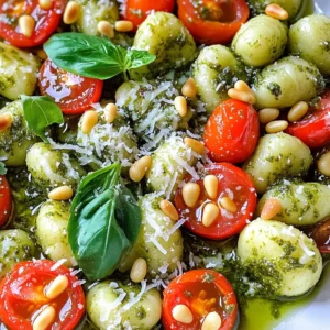 When choosing gnocchi, you have two great options: fresh or frozen. Fresh gnocchi cooks fast, taking only about 2-3 minutes in boiling water. It has a soft texture and rich flavor. I love using fresh gnocchi when I can find it. Frozen gnocchi is convenient and lasts longer. It takes a bit more time to cook, about 3-5 minutes. It also works well in this dish. So, choose what fits your needs best! This dish shines with just a few key ingredients: - 1 package (16 oz) gnocchi, fresh or frozen - 1 cup basil pesto (store-bought or homemade) - 1/2 cup grated Parmesan cheese - 1/4 cup toasted pine nuts - 2 tablespoons olive oil - 1 cup cherry tomatoes, halved - Salt and pepper to taste The basil pesto brings a fresh herb taste. Grated Parmesan adds a nice salty kick. Olive oil keeps the gnocchi from sticking and adds richness. Cherry tomatoes give the dish a sweet burst. To make your dish look and taste even better, consider adding these garnishes: - Fresh basil leaves for a pop of color and flavor - Extra grated Parmesan for richness - A sprinkle of red pepper flakes for some heat These toppings can elevate your meal. They are simple but make a big difference! To start, you need a big pot of water. Add salt to it and bring it to a boil. If you have fresh gnocchi, cook it for 2 to 3 minutes. Frozen gnocchi takes a bit longer, about 3 to 5 minutes. You know it's ready when the gnocchi floats to the top. This means they are done. Once cooked, drain the gnocchi in a colander. Return them to the pot right away. Now, add 2 tablespoons of olive oil to the hot gnocchi. This helps keep them from sticking. Next, stir in 1 cup of basil pesto. Mix gently to coat every piece of gnocchi well. After that, sprinkle in 1/2 cup of grated Parmesan cheese and 1/4 cup of toasted pine nuts. Toss everything again to combine. Finally, add 1 cup of halved cherry tomatoes. These add a fresh pop of flavor. Season your dish with salt and pepper to taste. To serve, scoop the gnocchi into bowls or a nice platter. For a pretty touch, add more grated Parmesan on top. Don’t forget to sprinkle some fresh basil leaves for color and taste. This makes your dish look stunning and appetizing. Enjoy your meal! To keep your gnocchi from sticking, focus on two key steps. First, make sure to use plenty of salted water when boiling. The salt helps flavor the gnocchi while cooking. Second, once you drain them, add olive oil right away. This oil creates a barrier that prevents sticking. Toss them gently in the pot to coat evenly. You can boost the flavor of your gnocchi easily. Here are some ideas: - Use fresh basil for a pop of taste. - Add garlic while cooking the gnocchi for depth. - Mix in some red pepper flakes for heat. - Try different nuts, like walnuts or pecans, for a unique twist. - Experiment with various cheeses, such as Pecorino or Asiago. You can prep this meal ahead to save time. Cook the gnocchi and toss them in olive oil. Store them in an airtight container in the fridge for up to two days. When ready to eat, just reheat them in a pan. Add the pesto, cheese, and tomatoes before serving. This method keeps your meal quick and tasty. {{image_2}} If you want to mix it up, try different pestos. You can use sun-dried tomato pesto for a rich flavor. Another option is arugula pesto, which gives a peppery twist. You might even enjoy a spinach pesto for a lighter taste. Each type adds a unique spin to your Minute Pesto Parmesan Gnocchi. Experiment and find your favorite! Adding protein makes this dish even heartier. Cooked chicken works well and adds great flavor. Shrimp is another tasty option; it cooks quickly and pairs perfectly. For a meatless meal, try chickpeas or white beans. They add protein and a nice texture. Just toss them in after the pesto for a filling meal! How you serve this dish can make it special. Try serving it in a large bowl with extra grated Parmesan on top. You can also add a drizzle of olive oil for shine. Consider garnishing with fresh basil leaves for color and flavor. For a fun twist, serve it in a roasted pepper or zucchini boat. The options are endless, so get creative! After enjoying your Minute Pesto Parmesan Gnocchi, you might have some left. To store it, place the gnocchi in an airtight container. This helps keep flavors fresh and prevents drying out. You can keep it in the fridge for up to three days. Make sure to let it cool down first before sealing the container. When it's time to enjoy your leftovers, you want them to taste just as good. You can reheat gnocchi in a few ways. The best method is to heat them in a skillet. Add a splash of olive oil over medium heat. Stir gently until they warm up. This keeps them soft and tasty. You can also use the microwave. Just place them in a microwave-safe bowl, cover it, and heat for about one minute. Check if they are warm enough and add more time if needed. If you want to store gnocchi for a longer time, freezing is a great option. First, cook the gnocchi according to package directions. After cooking, let them cool completely. Spread them in a single layer on a baking sheet. Freeze for about one hour. Once they are firm, transfer them to a freezer-safe bag or container. Label it with the date. They can stay frozen for up to three months. When you're ready to eat, cook them straight from frozen in boiling water. This way, they stay tasty and fresh! I recommend using fresh gnocchi when possible. Fresh gnocchi cooks quickly and has a soft texture. If fresh is not available, frozen gnocchi works well too. Just remember to cook it longer, about 3 to 5 minutes. Both types absorb flavors nicely, making them great for this dish. Yes, you can make this dish vegan! To do this, skip the Parmesan cheese or use a vegan cheese alternative. You can also replace the pesto with a vegan option made from nuts, herbs, and olive oil. This keeps the dish tasty and plant-based, perfect for everyone. Cooked gnocchi lasts about 3 to 5 days in the fridge. Store it in an airtight container to keep it fresh. When you’re ready to eat, just reheat it in a pan or microwave. This way, you enjoy your delicious meal again without much fuss. In this post, we explored how to make delicious gnocchi from selection to storage. You learned about fresh and frozen gnocchi, essential ingredients, and how to balance flavors. I shared tips to avoid stickiness and ways to store leftovers. Try adding your favorite proteins and sauces for a twist! With these steps, you can enjoy great gnocchi any day. Enjoy cooking and experimenting to find your perfect dish!