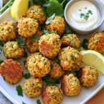 - 1 can (15 oz) chickpeas, drained and rinsed - 1/2 cup fresh parsley, chopped - 1/4 cup fresh cilantro, chopped - 1 small onion, roughly chopped - 2 cloves garlic, minced - 1 teaspoon ground cumin - 1 teaspoon ground coriander - 1/2 teaspoon baking powder - 1/4 teaspoon cayenne pepper (optional for heat) - Salt and pepper to taste - 1/4 cup all-purpose flour (or chickpea flour for gluten-free) - Olive oil spray You can change up these recipes with some fun options. If you need gluten-free, use chickpea flour instead of all-purpose flour. You can also add more spices if you want a bolder taste. Other herbs like mint or dill can give your falafel a fresh twist. Try adding paprika or garlic powder for extra flavor. To make the falafel, start with a food processor. Add the chickpeas, parsley, cilantro, onion, and garlic. Next, sprinkle in cumin, coriander, baking powder, cayenne pepper, salt, and pepper. Pulse this mix until it is coarsely blended, but not smooth. You want bits of herbs and chickpeas to remain. This keeps the texture nice and crunchy. After that, transfer the mixture to a bowl. Add flour, which helps bind everything. Mix well until the falafel holds together when you form a ball. If it crumbles, add a bit more flour. Now it’s time to shape the falafel. Take small amounts of the mixture and roll them into balls or patties, about 1.5 inches wide. You can also use a cookie scoop for even sizes. This helps them cook evenly. Before cooking, preheat your air fryer to 375°F (190°C). This step is crucial for getting that crispy texture. Lightly spray the fryer basket with olive oil. Place the falafel in a single layer to avoid overcrowding. Give the tops a quick spray with olive oil for extra crispiness. Cook the falafel bites for 10-12 minutes. Halfway through, flip them to ensure even browning. You’ll know they are done when they are golden brown and crispy. If you like them extra crispy, you can add a minute or two to the cooking time. Once cooked, remove the bites and keep them warm. Repeat the process with any remaining mixture. Enjoy your crispy air fryer falafel bites! To get that crispy texture, air circulation is key. The hot air in your air fryer cooks evenly. Make sure to layer the falafel bites without crowding. This gives each piece room to breathe and crisp up. A light spray of olive oil helps too. Spray the tops after placing them in the basket. Falafel bites taste great with sauces like tahini or tzatziki. These dips add creamy flavor and balance. For a beautiful presentation, garnish your plate with fresh herbs and lemon wedges. They make your dish pop visually and add extra zest. One common mistake is overcrowding the air fryer. This can lead to uneven cooking and soggy bites. Keep them in a single layer. Another mistake is having the wrong mixture consistency. If it’s too wet, your bites won't hold shape. Aim for a texture that sticks together when formed into balls. {{image_2}} You can spice up your falafel bites easily. For a spicy version, add cayenne pepper to the mix. Start with 1/4 teaspoon, then increase it if you like more heat. This gives a nice kick that pairs well with creamy dips. You can also create Mediterranean-inspired flavors. Try adding sun-dried tomatoes, olives, or even feta cheese. These ingredients will bring a new depth to the dish. The fresh herbs like parsley and cilantro will still shine through. If you want to explore other cooking methods, try oven-baked falafel. Preheat your oven to 400°F (200°C). Place the shaped falafel on a baking sheet lined with parchment paper. Bake for about 20-25 minutes, flipping halfway through. This method gives a different texture but is still tasty. You can also compare traditional frying with air frying. Frying gives a rich flavor but adds more fat. Air frying uses less oil and still achieves a crispy texture. It’s a great option for a healthier snack. Falafel bites are great on their own, but you can make them even better. Serve them on a salad for a fresh meal. They also work well in wraps. Use pita or flatbreads and add your favorite veggies. Don’t forget about dips! Serve your falafel with tahini or tzatziki for a creamy touch. You can even try a spicy harissa sauce for extra flavor. These creative dips will make your falafel bites shine. To keep your falafel bites fresh, use these simple tips: - Refrigeration: Place leftover falafel in an airtight container. They last about 3-5 days in the fridge. Make sure they cool down before sealing. - Freezing: For longer storage, freeze the falafel bites. Use a freezer-safe bag or container. They can stay good for up to 3 months. To freeze, arrange them in a single layer first. Once frozen solid, transfer them to a bag. When it’s time to enjoy your leftover falafel, follow these steps: - Air Fryer: Preheat your air fryer to 375°F (190°C). Place the falafel bites in a single layer. Heat for about 5-7 minutes. Flip them halfway to ensure crispiness. - Oven: Preheat your oven to 400°F (200°C). Spread the falafel on a baking sheet. Bake for 10-12 minutes. This method also keeps them crispy. To maintain that crunchy texture, avoid using the microwave. It can make them soggy. Enjoy your tasty snack! You can enjoy falafel with many tasty dips. Here are some great choices: - Tahini Sauce: A creamy sesame dip that adds a nutty flavor. - Tzatziki Sauce: A cool yogurt dip with cucumber and garlic. - Hummus: A classic chickpea dip that pairs well with falafel. - Spicy Harissa: A bold chili paste for those who love heat. - Sriracha: A sweet and spicy sauce that adds a kick. Each dip brings out the flavors of the falafel and makes your snack even better. Yes, you can freeze falafel before cooking. This is a great way to prep ahead. Here’s how: - Shape the falafel into balls or patties. - Place them on a baking sheet in a single layer. - Freeze until solid, then transfer to a freezer bag. To cook from frozen, just add a few extra minutes to your air fryer time. This keeps them crispy and delicious. You can tell falafel is done by looking for a few signs: - They should be golden brown and crispy on the outside. - When you press them lightly, they should feel firm. - A toothpick inserted should come out clean. These signs mean you have perfectly cooked falafel bites. Enjoy them hot for the best taste! Crispy air fryer falafel bites are easy and tasty. We covered the key ingredients, like chickpeas and fresh herbs, and shared tips for the perfect texture. You learned to shape, cook, and serve these bites with fun dips. Remember common mistakes, like not overcrowding the fryer. Feel free to explore variations and enjoy leftovers. With these tips, you can create delicious falafel at home. Enjoy your cooking journey!