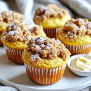 - 1 ½ cups all-purpose flour - ½ teaspoon baking soda - ½ teaspoon baking powder - 1 teaspoon ground cinnamon - 1 teaspoon pumpkin pie spice - ¼ teaspoon salt - 1 cup granulated sugar - ½ cup unsalted butter, softened - 2 large eggs - 1 cup canned pumpkin puree - 1 teaspoon vanilla extract - ½ cup chopped walnuts - Topping ingredients: - ¾ cup brown sugar - 1 teaspoon cinnamon - ½ cup oats - ½ cup flour These ingredients create a warm and cozy treat. The dry ingredients mix the flour with spices to capture the essence of fall. The baking soda and baking powder help the muffins rise. The wet ingredients mix sweet flavors with the creamy pumpkin. This gives the muffins their rich taste and moist texture. Adding walnuts gives a nice crunch, but they are optional. The topping is a game-changer. Brown sugar, oats, and cinnamon create a sweet, crunchy layer. It contrasts perfectly with the soft muffin base. You can adjust the topping to your taste. If you love more crunch, add more oats. This recipe is flexible, making it easy to customize for you and your family. - Preheat your oven to 350°F (175°C). This helps the muffins bake evenly. - In a bowl, whisk together 1 ½ cups of flour, baking soda, baking powder, ground cinnamon, pumpkin pie spice, and salt. Set this aside. - In a large bowl, beat ½ cup of softened butter and 1 cup of granulated sugar until it's light and fluffy. This takes about 2-3 minutes. - Add in 2 large eggs, one at a time. Mix well after each egg. This helps the batter blend smoothly. - Next, stir in 1 cup of canned pumpkin puree and 1 teaspoon of vanilla extract until the mixture is smooth. This gives the muffins their rich flavor. - Gradually fold in your dry ingredients. If you like, you can add ½ cup of chopped walnuts for a nice crunch. Be gentle when mixing to avoid tough muffins. - In a separate bowl, mix ¾ cup of brown sugar, ½ cup of oats, ½ cup of flour, and 1 teaspoon of cinnamon for the topping. This adds a great texture. - Spoon the muffin batter into your prepared muffin tin, filling each cup about two-thirds full. - Sprinkle the topping mixture generously on each muffin. This adds a sweet crunch on top. - Bake in your preheated oven for 18-22 minutes. Check with a toothpick. If it comes out clean, the muffins are ready. - Let the muffins cool in the pan for 5 minutes. Then, transfer them to a wire rack to cool completely. - Make sure your butter is softened. This helps it mix better. - Don’t overmix the batter. A few lumps are okay for fluffiness. - Use a toothpick to check if muffins are done. It should come out clean. - Serve your muffins warm with a light dusting of powdered sugar. - Pair them with cream cheese spread for extra flavor and creaminess. - Always measure your ingredients accurately. This keeps your muffins perfect. - Avoid overbaking. This can dry out your muffins and ruin the taste. {{image_2}} You can easily change the flavor of these muffins. - Add chocolate chips for a sweeter treat. They melt and make each bite delightful. - Substitute pecans for walnuts if you want a different taste. Pecans add a rich, buttery flavor. Want to make these muffins a bit healthier? - Use whole wheat flour for added fiber. This makes them heartier and more filling. - Replace sugar with a sugar substitute. This option keeps the sweetness without extra calories. You can also switch things up for the seasons. - Incorporate cranberries for a holiday twist. They add a tart burst of flavor. - Try swapping pumpkin for sweet potato puree. Sweet potatoes give a creamy texture and unique taste. To keep your Pumpkin Spice Coffee Cake Muffins fresh, store them in an airtight container at room temperature. This method works well for daily snacks. If you want them to last longer, refrigerate them. They stay good in the fridge for up to a week. If you have extra muffins, freeze them for later. Wrap each muffin in plastic wrap and place them in a freezer bag. They can last for up to three months this way. When you're ready to enjoy, simply thaw them at room temperature. You can also microwave them for a warm treat in just a few seconds. Reheating is easy and quick. For soft muffins, pop them in the microwave for 10 to 15 seconds. If you prefer a crispy exterior, use the oven. Just place the muffins on a baking sheet and heat at 350°F (175°C) for a few minutes. Enjoy your delicious muffins warm! Yes, but ensure it’s pureed and cooked down properly. Fresh pumpkin can add more flavor. Just bake the pumpkin until soft, then blend until smooth. This makes a great base for your muffins. They can last up to one week at room temperature. Store them in an airtight container. This keeps them fresh and moist. You can also place them in the fridge for longer life. Substitute with a gluten-free flour blend for a safe option. Many blends work well in baking. Look for one with a good mix of flours like almond or coconut. This way, everyone can enjoy these muffins! You can create delicious pumpkin muffins with simple ingredients. We covered dry and wet ingredients, plus optional add-ins for flavor. Follow the step-by-step guide for perfect muffins every time. Remember to avoid common baking mistakes. You can also try fun variations and store muffins for future snacks. Enjoy these sweet treats warm with your favorite toppings. Happy baking!