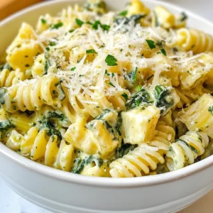 To make Creamy Spinach Artichoke Pasta, you will need a few key items. Here’s what you should gather: - 8 oz (225g) pasta (fusilli or penne) - 1 cup fresh spinach, chopped - 1 cup canned artichoke hearts, drained and chopped - 1 cup cream cheese, softened - 1/2 cup grated Parmesan cheese - 1/2 cup vegetable broth - 1/4 cup milk - 2 cloves garlic, minced - 1 teaspoon onion powder - 1/2 teaspoon red pepper flakes (optional) - Salt and pepper to taste - Fresh parsley, chopped (for garnish) This mix creates a rich and creamy sauce. The pasta acts as a base for the vibrant flavors of spinach and artichokes. Cream cheese and Parmesan add depth and creaminess. Garlic gives a nice kick, while red pepper flakes can add a bit of heat. Fresh parsley at the end not only looks nice but also brightens the dish. I love using fresh ingredients. They make the dish taste better and are often more healthy. Gathering these ingredients will set you up for a great cooking experience. {{ingredient_image_1}} First, cook the pasta. I suggest using fusilli or penne. Follow the package instructions. Aim for al dente, which means the pasta should be firm but cooked. This helps the pasta hold its shape. After cooking, drain it. Remember to save about 1/2 cup of the pasta water. This water adds flavor and helps the sauce stick later. Next, we prepare the sauce. In a large skillet, heat a splash of olive oil over medium heat. Add minced garlic and sauté it for about one minute. The smell will be fantastic! Then, add the chopped spinach and artichoke hearts. Cook for about 2-3 minutes. The spinach should wilt down nicely. This mix makes the base of our creamy sauce. Now, let’s blend the creamy mixture. In a bowl, combine softened cream cheese, vegetable broth, and milk. Stir until it’s smooth. Pour this mixture into the skillet with the spinach and artichokes. Mix well to combine. Add in the cooked pasta, grated Parmesan cheese, onion powder, and red pepper flakes if you like some heat. Don't forget the reserved pasta water! Toss everything together until the pasta is well coated in the creamy sauce. Season with salt and pepper to taste. Heat everything through for an extra 3-4 minutes while stirring gently. Serve it hot and enjoy your creamy spinach artichoke pasta! To get the right creaminess, start with cream cheese. If the sauce feels too thick, add a little more milk. This makes it smooth and easy to mix. If it’s too thin, let it cook a bit longer. The heat helps it thicken up. Using pasta water is key for the sauce. When you drain your pasta, keep some water. This starchy water helps bind the sauce to the pasta. Just add a little at a time until you get the right consistency. You can boost the flavor of your dish with more spices. Add garlic powder, black pepper, or even Italian herbs. These extra touches make every bite tasty. If you want a kick, try adding more red pepper flakes. For a twist, consider adding sun-dried tomatoes or olives. They add a rich flavor and texture. You can also mix in some cooked chicken or shrimp for protein. For presentation, serve the pasta in deep bowls. Top it with extra Parmesan cheese and fresh parsley. This adds color and looks appealing. You can even place a few artichoke pieces on top for decoration. Pair your pasta with a simple salad or garlic bread. These sides complement the creamy dish well. You can also enjoy it with grilled chicken or fish for a complete meal. Pro Tips Fresh Spinach Matters: Always opt for fresh spinach to achieve a vibrant color and maximum flavor in your dish. Cheese Variations: You can substitute cream cheese with ricotta or mascarpone for a different creamy texture and taste. Perfect Pasta Texture: Make sure to cook the pasta just until al dente for the best texture, as it will continue to cook slightly when combined with the sauce. Garnish for Presentation: Don't skip the parsley and extra Parmesan on top; it not only enhances the flavor but also adds a beautiful finishing touch to your dish. {{image_2}} For a vegan option, you can swap cream cheese for cashew cream or tofu. Both add creaminess and flavor. You can also choose almond milk instead of regular milk. For gluten-free needs, use gluten-free pasta like brown rice or quinoa noodles. These options keep your dish tasty and satisfying. Feel free to add other veggies to your pasta. Zucchini, bell peppers, or mushrooms work well. They add flavor and nutrients. If you want to change the cheese, try nutritional yeast for a cheesy taste without dairy. You can also use vegan cheese if you prefer. If you prefer a one-pot meal, cook the pasta in the same pot. Add the spinach and artichokes when the pasta is almost done. Stir in the cream cheese mixture last. This saves time and makes cleanup easy. For a baked version, make the pasta as usual, then transfer it to a baking dish. Top with extra cheese and bake at 350°F (175°C) for 20 minutes. This gives a nice, crispy top and makes the dish even more comforting. To keep your creamy spinach artichoke pasta fresh, you should store it in the fridge. Use an airtight container and place it in the fridge within two hours of cooking. It will stay good for about three days. If you want to store it longer, consider freezing it. For freezing, let the pasta cool completely before packing it into a freezer-safe container. It can last for up to three months in the freezer. Just be sure to label the container with the date. To reheat your pasta, the best method is using the stovetop. Place the pasta in a skillet over low heat. Add a splash of milk or broth to help bring back the creaminess. Stir frequently to avoid burning. You can also use the microwave, but be careful not to overheat it. This may change the texture and make it less creamy. A gentle reheat keeps the flavors intact and the pasta smooth. The total time to make this dish is about 25 minutes. Here’s how it breaks down: - Prep Time: 10 minutes - Cook Time: 15 minutes You’ll find that it’s quick and easy. This makes it perfect for busy nights. Yes, you can use frozen spinach or artichokes. Just follow these tips: - Spinach: Thaw and drain it well. Squeeze out extra water. - Artichokes: Use canned artichokes if frozen ones are not available. Frozen options save time. They also work well in this creamy dish. Creamy Spinach Artichoke Pasta can be a part of a healthy diet. Here’s what to know: - Calories: One serving has around 400 calories. - Nutrients: It contains vitamins from spinach and protein from cheese. To make it lighter, consider using less cheese or whole-grain pasta. This way, you can enjoy it without worry. In this post, I shared a simple way to make Creamy Spinach Artichoke Pasta. We covered key ingredients, cooking steps, and tips for a great dish. Remember to reserve pasta water; it helps the sauce stick. Explore variations for dietary needs, like vegan swaps or baking methods. Proper storage keeps your leftovers fresh. Enjoy experimenting with flavors and making this dish your own. Each bite can bring comfort and delight, so dive in and savor the experience.