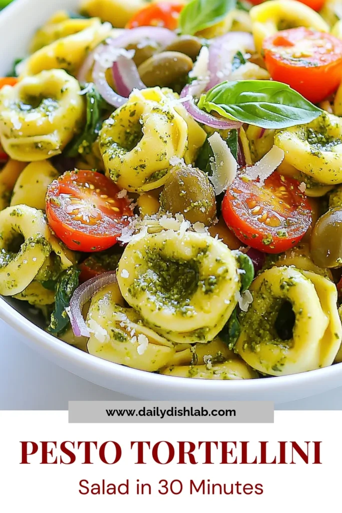 Discover the deliciousness of Pesto Tortellini Pasta Salad, an easy pasta salad with pesto that's perfect for any occasion! Made with cheese tortellini, fresh spinach, and cherry tomatoes, this cold tortellini salad is both vibrant and refreshing. Elevate your meal with this Mediterranean pasta salad with spinach, sure to impress everyone at the table. Try this cheese tortellini salad recipe today and let the flavors shine! Save this for your next potluck! #PastaSalad #Tortellini #Pesto #MediterraneanSalad