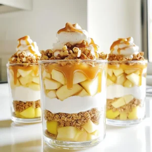 - 3 medium apples (Granny Smith or Honeycrisp) - 1 tablespoon lemon juice - 1 teaspoon cinnamon - 1 cup granola - 2 cups Greek yogurt - 1/2 cup caramel sauce - 1/4 cup chopped nuts (optional) - Whipped cream for topping (optional) For the best Caramel Apple Yogurt Parfaits, picking the right apples is key. I love using Granny Smith or Honeycrisp apples. They give a nice balance of tartness and sweetness. You will also need lemon juice. It keeps the apples fresh and adds brightness to the dish. Cinnamon is another must-have. It adds warmth and depth to the flavors. Next, granola is a fun addition. You can use either store-bought or homemade. The crunch brings a great texture to the parfaits. Greek yogurt is the star of this recipe. I prefer plain or vanilla for a creamy base. You cannot forget the caramel sauce! Use store-bought for ease or make your own for a special touch. Chopped nuts are optional but add a delightful crunch. Walnuts or pecans are great choices. Lastly, whipped cream is a fun topping. It makes your parfaits look even more inviting. With these ingredients, you will create a delightful treat everyone will enjoy. First, peel, core, and dice your apples. I like using Granny Smith or Honeycrisp for a nice crunch. In a bowl, toss the diced apples with 1 tablespoon of lemon juice and 1 teaspoon of cinnamon. This step is key. It stops the apples from browning and adds a burst of flavor. Let the apples sit for about 10 minutes. This marinating time helps them soak in the lemon and cinnamon. Now, grab your clear glasses or bowls. Start by adding a layer of Greek yogurt. Use about one-third of the yogurt you have. Next, spoon a layer of your cinnamon apples over the yogurt. The sweet and tart apples will pair well with the creamy yogurt. After that, sprinkle a layer of granola on top. This adds a crunch that everyone loves. Then, drizzle a generous amount of caramel sauce over the granola. Repeat these layers until your glasses are full. Remember to finish with a layer of yogurt on top for a pretty presentation. For the final touches, you can add whipped cream if you want that extra creaminess. Sprinkle chopped nuts on top for some crunch. Finally, drizzle more caramel sauce over everything. This makes your parfaits look amazing and adds extra sweetness. For the best caramel apple yogurt parfaits, I suggest using Granny Smith or Honeycrisp apples. These apples add a nice balance of sweet and tart flavors. Granny Smith apples are tart and crisp, while Honeycrisp apples are sweet and juicy. The type of apple you choose will change the taste of your parfait. So, pick one that suits your preference! You can choose between plain or flavored Greek yogurt. Plain yogurt gives a pure taste and lets the apple flavors shine. Flavored yogurt adds sweetness, so it’s up to you! You can also make your yogurt at home or buy it from the store. Store-bought yogurt saves time, while homemade yogurt can have a unique taste and texture. To create beautiful layers, start with yogurt at the bottom. Use clear glasses to show off the layers. Add a layer of apples, then granola, and drizzle caramel sauce. Repeat these layers for a stunning look. Make sure to distribute each layer evenly. This way, every bite will have a taste of everything! {{image_2}} You can change the flavors of your caramel apple yogurt parfaits with the seasons. In fall, I love adding pumpkin spice. Just a pinch in the apple mix makes a warm, cozy treat. It pairs so well with the caramel and yogurt. For summer, try adding fresh berries like strawberries or blueberries. They add a bright flavor and a nice color. Layer them with the apples for a fruity twist. If you need gluten-free options, look for gluten-free granola. Many brands offer tasty mixes that fit this need. You can also make your own granola at home, using oats and nuts. If you're dairy-free, swap Greek yogurt for coconut yogurt or almond yogurt. These alternatives still give rich flavor and texture. Kids love making their parfaits fun! Let them choose toppings like sprinkles, mini chocolate chips, or fruit. You can also adjust the sweetness by using less caramel sauce. This way, it stays healthy but still tastes sweet. Making it a fun activity can get kids excited about healthy snacks. You should store your assembled parfaits in the fridge. Use airtight containers to keep them fresh. If you have leftovers, consume them within 2 days. For best flavor, store any extra apple mixture in a separate container. Keep granola in a dry place to maintain its crunch. Unfortunately, you cannot freeze parfaits once they are assembled. Freezing yogurt changes its texture. However, you can freeze the components separately. Freeze diced apples in a single layer on a tray, then transfer them to a bag. You can also freeze granola in an airtight container for up to 3 months. In the fridge, parfaits last up to 2 days. After that, the apples may become mushy. Check for any off smells or discoloration. If the yogurt smells sour or the granola feels soft, these are signs of spoilage. Always trust your senses when checking food freshness. The best apples for caramel apple parfaits are Granny Smith and Honeycrisp. - Granny Smith: These apples are tart, which balances the sweetness of caramel. - Honeycrisp: They are sweet and juicy, adding great flavor and texture. Using a mix of both can enhance the taste. Choose fresh apples for the best crunch. Yes, you can prepare caramel apple yogurt parfaits ahead of time. - Assemble the parfaits and cover them well. - Keep them in the fridge for up to 2 days. Layer the ingredients carefully to avoid sogginess. Add granola just before serving for extra crunch. You can substitute Greek yogurt with regular yogurt or a dairy-free option. - Regular Yogurt: It will still give a creamy texture but with less protein. - Dairy-Free Yogurt: Options like almond or coconut yogurt work well. Choose plain or vanilla flavors to match the recipe. Yes, you can make this recipe nut-free easily. - Simply skip the chopped nuts on top. - Use nut-free granola to ensure safety for those with allergies. This keeps the parfait delicious and safe for everyone. To make caramel apple yogurt parfaits healthier, you can: - Use low-fat Greek yogurt instead of full-fat. - Choose a natural or reduced-sugar caramel sauce. - Add more fruits like berries for added nutrients. These changes will keep the treat tasty while making it lighter. This parfait recipe combines apples, yogurt, and caramel for a tasty treat. You learned the right ingredients and steps to prepare this dish. We covered tips for choosing apples, yogurt options, and ensuring perfect layers. You can also explore fun variations and storage tips. In summary, this recipe caters to your taste and dietary needs. Enjoy mixing flavors and creating a dessert that everyone will love!