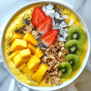 - 1 ripe mango, peeled and diced - 1 cup coconut milk (full-fat or light) - 1 ripe banana, sliced - 1 tablespoon honey or agave syrup (optional) - 1 teaspoon vanilla extract - 1/2 cup rolled oats - 1/2 cup granola (for topping) - 1/4 cup shredded coconut (toasted) - Fresh fruits for garnish (e.g., strawberries, kiwi, more mango) - Chia seeds or hemp seeds (for topping, optional) Gather these ingredients to create a tasty Coconut Mango Smoothie Bowl. Using ripe mangoes makes a big difference. They bring a natural sweetness and a creamy texture. Coconut milk adds a rich flavor, making the bowl feel indulgent. Bananas also help with creaminess and sweetness. Honey or agave syrup can sweeten the bowl, but it’s optional. Vanilla extract adds depth to the flavor. The rolled oats give it a nice thickness. Granola adds a crunch, while toasted coconut gives a lovely, nutty taste. You can finish it off with fresh fruits like strawberries, kiwi, or more mango. Chia seeds or hemp seeds are great for added nutrition. This mix of flavors and textures makes the smoothie bowl a delightful treat. Enjoy each bite! {{ingredient_image_1}} - First, gather your ripe mango, coconut milk, banana, honey, and vanilla. - In your blender, combine the diced mango, coconut milk, sliced banana, honey, and vanilla extract. - Blend on high speed until the mixture is smooth and creamy. This should take about 30 seconds. - Now, add the rolled oats to your blender. - Pulse the blender a few times. This keeps the oats slightly chunky for added texture. - Taste your smoothie. If you want it sweeter, add more honey or agave syrup. Blend briefly to mix. - Carefully pour the smoothie into a bowl. - Decorate the top with granola, shredded coconut, and fresh fruits like strawberries, kiwi, or more mango. - For an extra nutritional boost, sprinkle chia seeds or hemp seeds on top. - Serve immediately for the best flavor. Enjoy every refreshing spoonful! Look for ripe mangoes to get the best taste. A ripe mango feels soft when you gently squeeze it. The color should be bright, often with some red or yellow tones. This fruit gives your smoothie bowl the sweet flavor it needs. If it’s too hard, let it sit for a day or two to ripen. To make your smoothie bowl vegan, swap honey for agave syrup. Agave syrup is a great choice. It has a mild flavor and works well in smoothies. You can use the same amount as honey. This change keeps your dish plant-based while still tasting sweet and yummy. You can boost your smoothie bowl with extra toppings. Here are some options: - Chia seeds - Hemp seeds - Sliced almonds - Walnuts - Pumpkin seeds These toppings add fiber, healthy fats, and protein. They also give your bowl a nice crunch. Mix and match toppings to find your favorite combination! Pro Tips Using Frozen Fruits: If you want a thicker texture, consider using frozen mango or banana instead of fresh. This will give your smoothie bowl a nice creamy consistency. Sweetness Adjustment: Taste your smoothie before adding any sweeteners. Depending on the ripeness of your fruits, you might find it sweet enough without additional honey or agave. Toasting Coconut: For a deeper flavor, toast the shredded coconut in a dry skillet over medium heat until golden brown. This enhances the nuttiness and adds a delicious crunch. Garnish Creatively: Experiment with different toppings such as nuts, seeds, or other fruits to add texture and nutritional value to your smoothie bowl. {{image_2}} You can give your Coconut Mango Smoothie Bowl a fun twist. Try adding other fruits like pineapple or papaya. These fruits mix well with mango. They add extra sweetness and flavor. Pineapple gives a tangy taste, while papaya adds creaminess. Just chop them up and blend with the mango. You’ll create a smoothie bowl that feels like a tropical vacation! If you want a dairy-free option, there are many plant-based milks to try. Almond milk, soy milk, or oat milk all work great. Each type adds its own flavor. Almond milk is nutty, while oat milk is creamy. You can choose based on your taste. Use the same amount as coconut milk in the recipe. This keeps your bowl smooth and delicious. Want to spice things up? You can add flavors like cinnamon or cardamom. These spices give warmth to your smoothie bowl. Just a pinch is enough to make a big difference. Mix them in while blending. You might even try a little ginger for a zing! Adding these flavors makes your bowl unique and tasty. You can store leftover smoothie bowl in the fridge. Use an airtight container to keep it fresh. It stays good for about one day. If you see any separation, stir it well before serving. To freeze, pour the leftover smoothie into freezer-safe bags. Remove as much air as possible. This helps prevent freezer burn. You can freeze it for up to one month. When ready to eat, thaw it in the fridge overnight or blend it straight from the freezer. To avoid separation, mix it well before storage. Keep toppings separate until serving to maintain crunch. If you notice any texture changes, blend again before serving. This keeps your smoothie bowl creamy and enjoyable. To make your smoothie bowl thicker, you can add more rolled oats. This helps create a hearty texture. Another option is to use less coconut milk. Start with half a cup and add more only if needed. You can also try adding ice cubes to the blender. This will chill the mix while making it thicker. Lastly, using frozen fruits can also help. Just blend them well for a creamy finish. Yes, you can use frozen fruits for your smoothie bowl. Frozen mango and banana are excellent options. They make the smoothie super cold and thick. Plus, they are often picked at peak ripeness, which boosts flavor. If you use frozen fruits, you might want to reduce the coconut milk a bit. This keeps the bowl from being too watery. Just blend until smooth and enjoy the frosty treat. Yes, this recipe is great for meal prep. You can blend the smoothie and store it in the fridge for up to a day. Just keep it in an airtight container. When you’re ready to eat, add your toppings fresh. If you want to prep ahead, chop the fruits and oats in advance. Store them separately. This way, you can whip up your smoothie bowl in no time! This blog post guides you through making a delicious smoothie bowl. We covered the best ingredients, easy steps, and helpful tips. You learned how to choose ripe mangoes and make a vegan version. Adding toppings enhances flavor and nutrition. You can adjust the thickness and even use frozen fruits. Enjoy your smoothie bowl, and get creative with flavors and toppings. Remember, make it your own!