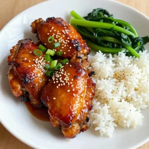 To make Spicy Maple Glazed Chicken, gather these key ingredients: - 4 boneless, skinless chicken thighs - 1/4 cup pure maple syrup - 2 tablespoons soy sauce - 1 tablespoon garlic, minced - 1 tablespoon fresh ginger, minced - 1 teaspoon red chili flakes (adjust for spice preference) - 1 tablespoon apple cider vinegar - Salt and pepper to taste - 1 tablespoon olive oil These items create the sweet and spicy glaze that makes this dish shine. You can enhance your dish with these fun garnishes: - Chopped green onions - Sesame seeds These add a pop of color and crunch to your plate. They also bring extra flavor that complements the chicken. To control the spice in your dish, adjust the red chili flakes. - For mild heat, use 1/2 teaspoon. - For medium heat, stick with 1 teaspoon. - For a fiery kick, use 1 tablespoon. Feel free to experiment and find the heat level you enjoy most! {{ingredient_image_1}} First, gather your ingredients. In a bowl, mix the maple syrup, soy sauce, garlic, ginger, red chili flakes, apple cider vinegar, salt, and pepper. Whisk them together until smooth. Next, take your chicken thighs and place them in a resealable bag or a shallow dish. Pour the marinade over the chicken. Seal the bag or cover the dish tightly. Let it sit in the fridge for at least one hour, or overnight for a stronger taste. After marinating, it’s time to cook. Preheat your oven to 375°F (190°C). Heat olive oil in a large oven-safe skillet over medium heat. Take the chicken thighs out of the marinade, but keep the marinade for later. Place the chicken in the skillet. Sear each side for about 4-5 minutes until they turn golden brown. This step adds flavor and color. Now, pour the reserved marinade over the seared chicken. Carefully transfer the skillet to the preheated oven. Bake the chicken for 20-25 minutes. You want it cooked through, reaching an internal temperature of 165°F (75°C). Once done, take the skillet out of the oven. Let the chicken rest for five minutes before slicing. This will help keep the juices in. For a nice touch, garnish with chopped green onions and sesame seeds before serving. To get the best flavor, marinate the chicken for a long time. I recommend at least one hour, but overnight is even better. The longer the chicken sits in the marinade, the more it soaks up the sweet and spicy flavors. Use fresh garlic and ginger for a vibrant taste. Adjust the red chili flakes to control how spicy you want it. More flakes mean more heat! Searing the chicken is key for juicy meat. Heat olive oil in a skillet before adding the chicken. This creates a nice golden crust. Cook each side for about 4 to 5 minutes. After searing, pour the marinade over the chicken and bake it. This keeps the chicken moist and adds more flavor. Always check the internal temperature; it should reach 165°F (75°C) for safety. For a complete meal, serve the chicken over steamed jasmine rice. The rice helps balance the spice and sweetness. Add sautéed greens like spinach or bok choy for color and nutrition. Don't forget to drizzle extra glaze over everything for more flavor. Garnish with chopped green onions and sesame seeds for a pop of color and crunch! Pro Tips Marinate Longer: For the best flavor, marinate the chicken thighs overnight. This allows the spices and sweetness to penetrate deeply into the meat. Adjust Spice Level: If you prefer a milder dish, reduce the amount of red chili flakes. You can also add them gradually while cooking to control the heat. Perfect Searing: Ensure your skillet is hot enough before adding the chicken. A good sear locks in the juices and gives a delicious crispy exterior. Resting Time: Let the chicken rest for at least 5 minutes after baking. This helps the juices redistribute, making the chicken tender and juicy. {{image_2}} You can switch the chicken thighs for other meats. Try boneless chicken breasts for a leaner option. Pork tenderloin works well too and can soak up the glaze nicely. If you want a plant-based choice, use tofu. Firm tofu absorbs flavors well. Cut it into cubes and follow the same marinating steps. If you have allergies, some swaps help. For gluten-free meals, choose tamari instead of soy sauce. Maple syrup can be replaced with agave nectar for a different sweetness. If you want less sugar, use coconut aminos. This swap keeps the flavor but cuts the sugar. Add more spice for extra flavor! Try smoked paprika for a deeper taste. A dash of cayenne pepper adds heat without changing the recipe too much. For a sweet twist, mix in some cinnamon. It pairs well with maple syrup and gives a warm flavor. Don't be afraid to experiment! Store leftover spicy maple glazed chicken in an airtight container. This keeps it fresh. Place the chicken in the fridge if you plan to eat it within three days. If you have more chicken, you can keep it longer. To reheat, use the oven or a skillet. In the oven, set it to 350°F (175°C). Place the chicken on a baking sheet and cover it with foil. Heat for about 15-20 minutes. In a skillet, add a little water or broth. This keeps the chicken moist as you warm it. Heat on low and cover the skillet. To freeze spicy maple glazed chicken, first cool it completely. Then, wrap it tightly in plastic wrap. Place it in a freezer-safe bag or container. This helps prevent freezer burn. Label the bag with the date. You can freeze it for up to three months. When ready to eat, thaw it in the fridge overnight. Then, reheat using the methods above. Yes, you can use bone-in chicken. It adds more flavor and moisture. Just adjust the cooking time. Bone-in chicken takes longer to cook. Make sure it reaches 165°F (75°C) inside. If using bone-in thighs, increase baking time by about 10-15 minutes. To grill the chicken, first marinate it as usual. Heat the grill to medium-high. Remove the chicken from the marinade, but keep the extra sauce. Grill the chicken for about 6-7 minutes on each side. Brush the reserved sauce on during the last few minutes of cooking. This will add a nice glaze. To check if the chicken is done, use a meat thermometer. Insert it in the thickest part of the thigh. It should read 165°F (75°C). If you don't have a thermometer, cut into the chicken. The juices should run clear, and the meat should not be pink. Always check in several spots to be sure. This blog post outlined how to make Spicy Maple Glazed Chicken. You learned about the main and optional ingredients, cooking steps, and tips for the best results. I also shared variations for different diets and storage tips for leftovers. In closing, this recipe is simple and delicious. You can enjoy it with many sides and adjust the heat to fit your taste. Enjoy cooking, and make this dish your own!