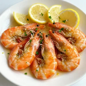 - 1 pound large shrimp, peeled and deveined - 4 cloves garlic, minced - 1/4 cup olive oil - Juice of 2 lemons - Zest of 1 lemon - 1 teaspoon red pepper flakes - 1 teaspoon salt - 1/2 teaspoon black pepper - 1 tablespoon fresh parsley, chopped (for garnish) - Lemon wedges (for serving) Gathering the right ingredients is key to making this dish shine. The shrimp brings a sweet and tender base. Fresh garlic adds a punch of flavor. A splash of olive oil gives it richness. The lemon juice and zest brighten up the dish. They bring a tangy taste that pairs well with the shrimp. Red pepper flakes add a hint of heat. Adjust the amount to suit your taste. For seasoning, the salt and black pepper enhance all the flavors. Fresh parsley is a lovely garnish. It adds color and freshness. Don't forget to serve with lemon wedges for extra zing! {{ingredient_image_1}} - Preheat the oven to 400°F (200°C). - Line a baking sheet with parchment paper. Start by heating your oven. This step ensures that the shrimp cook evenly. Next, line your baking sheet with parchment paper. This will help with easy cleanup and keep the shrimp from sticking. - Combine ingredients in a bowl. - Toss shrimp in marinade and let sit for 15-20 minutes. In a medium bowl, combine minced garlic, olive oil, lemon juice, lemon zest, red pepper flakes, salt, and black pepper. Mix these well. Add the shrimp to this bowl. Toss the shrimp until they are fully coated in the marinade. Let them sit for 15 to 20 minutes. This time helps the shrimp soak up all the yummy flavors. - Spread shrimp on the baking sheet. - Roast for 8-10 minutes until cooked through. After marinating, spread the shrimp out on the baking sheet in a single layer. Make sure they are not crowded. Roast them in the preheated oven for 8 to 10 minutes. You’ll know they’re done when they turn pink and opaque. Be careful not to overcook them; otherwise, they can become tough. To cook shrimp just right, timing is key. Roast them for 8-10 minutes. Check for pink color and a firm texture. When shrimp turn opaque, they are done. If you overcook them, they get tough. So, keep an eye on them! Want to boost the taste? Try adding fresh herbs like basil or cilantro. You can also mix in spices like paprika or cumin for a unique twist. If you like heat, add more red pepper flakes or a dash of cayenne. This will give your dish a great kick! Serving shrimp well makes a big impact. Arrange them on a nice plate in a single layer. Add lemon wedges around the shrimp. This adds color and freshness. For garnish, sprinkle chopped parsley on top. You can also use lemon zest for a beautiful touch. Get creative, and your dish will shine! Pro Tips Fresh Shrimp is Key: Always opt for fresh shrimp if possible, as they provide the best flavor and texture. If using frozen shrimp, ensure they are fully thawed and drained before marinating. Marinate for Flavor: Allow the shrimp to marinate for at least 15-20 minutes at room temperature. This helps the shrimp absorb the garlic and lemon flavors more effectively. Don’t Overcook: Keep a close eye on the shrimp while roasting; they cook quickly. Once they turn pink and opaque, they are ready. Overcooking will make them tough and rubbery. Serve with Fresh Herbs: Garnishing with fresh parsley not only adds a pop of color but also enhances the dish’s overall flavor. Consider adding other herbs like basil or cilantro for a different twist. {{image_2}} If you want to switch things up, you can use scallops or chicken instead of shrimp. Both options work well with the lemon garlic flavor. Scallops cook quickly and will take on the marinade nicely. Chicken adds heartiness and can be cooked to a safe temperature easily. You can also try different citrus fruits. For a twist, use lime or orange juice. Each fruit adds its own unique flavor, keeping your dish exciting and fresh. Roasting shrimp is fantastic, but grilling offers a smoky flavor. Simply preheat your grill and cook shrimp for about 2-3 minutes per side. It’s quick, and the grill marks add a nice touch. If you need a faster option, stovetop cooking works too. Just heat a skillet, add some oil, and sauté the marinated shrimp for about 4-5 minutes. This method gives you a great sear and keeps the shrimp juicy. For those who need gluten-free meals, this dish is naturally safe. Just make sure all your ingredients, especially any added sauces, are gluten-free. If you’re watching carbs, this dish fits right in. Shrimp is low in carbs, making it a great choice for low-carb diets. Pair it with a side of veggies for a full meal that keeps it light and healthy. To store leftovers, place the shrimp in an airtight container. This keeps them fresh. You can also cover the dish tightly with plastic wrap. The shrimp are best when eaten within 2-3 days. After that, the flavor and texture may change. If you want to freeze cooked shrimp, first cool them completely. Place the shrimp in a freezer-safe bag. Squeeze out as much air as you can before sealing. They can last for up to 3 months in the freezer. When you are ready to eat them, thaw the shrimp overnight in the fridge. To reheat, warm them gently in a skillet over low heat. This keeps them tender. You can prepare the shrimp in advance for easy meals. Marinate them the night before and store them in the fridge. This will enhance the flavor. For meal planning, use leftover shrimp in salads or pasta dishes. They add great taste and protein to your meals. I recommend cooking shrimp for 8 to 10 minutes at 400°F (200°C). This time ensures your shrimp become pink and opaque. Overcooking can lead to a rubbery texture. Always check them near the end of the cooking time. If they look cooked, take them out! Yes, you can use frozen shrimp! Just make sure to thaw them first. Place the shrimp in a bowl of cold water for about 15 minutes. After thawing, pat them dry with a paper towel. This helps the marinade stick better. Follow the rest of the recipe as usual! Roasted shrimp pairs well with many sides. Here are a few great options: - Garlic bread for a crunchy bite - A fresh salad with citrus dressing - Steamed vegetables like broccoli or asparagus - Rice or quinoa to soak up the juices These sides can make your meal more complete and tasty! This post covered the key ingredients, preparation steps, and tips for delicious roasted shrimp. You'll appreciate how easy it is to prepare this dish and the flavor options available. Remember, variations exist if you want to switch ingredients or cooking methods. Storing or meal prepping your shrimp can save time and effort. Enjoy your cooking journey, and don’t hesitate to experiment with flavors. The perfect roast shrimp is waiting for you!
