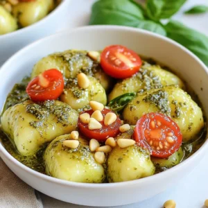 To make creamy pesto gnocchi, you need these key ingredients: - 1 pound store-bought potato gnocchi - 1 cup fresh basil leaves - 1/2 cup pine nuts (toasted) - 1/2 cup grated Parmesan cheese - 2 cloves garlic, minced - 1/2 cup heavy cream - 2 tablespoons olive oil - Salt and pepper, to taste These ingredients work together to create a rich and tasty dish. Garnishes add a nice touch to your meal. Consider these options: - Cherry tomatoes, halved - Extra pine nuts - Fresh basil leaves These add both color and flavor to your plate. You can swap some ingredients if needed. Here are a few ideas: - Use cashews instead of pine nuts for a different taste. - Swap heavy cream for coconut cream for a dairy-free version. - Try nutritional yeast instead of Parmesan for a vegan option. These swaps keep your dish yummy while catering to different diets. {{ingredient_image_1}} To cook the gnocchi, start by boiling a large pot of salted water. Once the water bubbles, add the gnocchi. Cook them for about 2-3 minutes. You’ll know they’re done when they float to the top. After that, drain them in a colander and set them aside. This step is fast, so keep an eye on them! For the pesto, grab your food processor. Add fresh basil leaves, toasted pine nuts, grated Parmesan cheese, and minced garlic. Pour in the olive oil next. Blend until the mixture is smooth. If it feels too thick, add a tablespoon of water. Make sure to taste it, then add salt and pepper as needed. This fresh pesto packs a big flavor punch! In a large skillet, pour in the heavy cream. Heat it over medium heat until it just begins to simmer. Then, stir in your homemade pesto. Mix it well and let it cook for 2-3 minutes. This will help the flavors blend and the sauce thicken slightly. It smells amazing! Once done, fold in your cooked gnocchi. Stir gently to coat each piece in creamy goodness. Cook for another 2 minutes to heat through. Now you’re ready to serve! To get the right pesto texture, blend your ingredients well. Start with the basil, pine nuts, Parmesan, and garlic. Add the olive oil slowly for a smooth mix. If it feels too thick, add a tablespoon of water. This helps to make it creamy and easy to stir into the sauce. Serve your creamy pesto gnocchi in bowls. Top it with halved cherry tomatoes for a splash of color. Add extra pine nuts for crunch and fresh basil for aroma. Pair it with a side salad or garlic bread for a full meal. Enjoy it warm for the best flavor! One common mistake is overcooking the gnocchi. Cook them just until they float. This keeps them soft and fluffy. Another mistake is not seasoning the pesto. Always taste and adjust with salt and pepper. Lastly, don’t skip the cream sauce step. It adds richness and brings everything together. Pro Tips Use Fresh Basil: For the best flavor, always use fresh basil leaves in your pesto. Dried basil won't provide the same vibrant taste. Toast Pine Nuts: To enhance the nutty flavor, toast the pine nuts in a dry skillet over medium heat until golden brown before adding them to the pesto. Adjust Cream Thickness: If you prefer a thinner sauce, feel free to add a bit more cream or a splash of pasta cooking water when combining with the gnocchi. Garnish for Color: Don't skip the garnishes! Fresh basil, cherry tomatoes, and extra pine nuts add color and freshness to your dish. {{image_2}} To make this dish vegan, swap the cream and cheese. Use cashew cream instead of heavy cream. For cheese, try nutritional yeast. Blend fresh basil, toasted pine nuts, garlic, and olive oil as usual. This keeps the pesto tasty and creamy. You can add protein to your gnocchi for a heartier meal. Cook diced chicken in a skillet until golden. For shrimp, sauté it until it turns pink. Mix your protein into the creamy pesto sauce before adding the gnocchi. This makes the dish filling and flavorful. If you're avoiding gluten, look for gluten-free gnocchi. Many brands offer this option, made from ingredients like rice or potato. The cooking method stays the same. Just follow the package instructions. Your creamy pesto gnocchi will still taste delicious and satisfying! Once you finish your meal, store any leftovers in an airtight container. Let the gnocchi cool to room temperature first. This helps keep the texture nice. You can store it in the fridge for up to three days. Be sure to label the container with the date. This way, you know when you made it. When you're ready to enjoy leftovers, reheat the gnocchi gently. You can use a skillet on medium heat. Add a splash of water or cream to keep it moist. Stir often to heat it evenly. You want it warm, not hot. This keeps the gnocchi soft and creamy. You can freeze creamy pesto gnocchi if you want to save some for later. Start by letting it cool completely. Then, place it in a freezer-safe container. Make sure to leave some space for expansion. You can freeze it for up to three months. When you're ready to eat it, thaw it in the fridge overnight. Reheat it in a skillet with a little cream or water to bring back its creamy texture. It takes about 2 to 3 minutes to cook gnocchi. Start by boiling a large pot of salted water. Once it reaches a rolling boil, add the gnocchi. Watch carefully as they float to the surface. When they do, they are ready! Drain them well and set aside while you make the sauce. Yes, you can use jarred pesto if you’re short on time. Just grab your favorite brand from the store. While fresh pesto tastes great, jarred options can still deliver good flavor. Mix it with the cream sauce as you would with homemade pesto. Creamy pesto gnocchi pairs well with many sides. Try a light salad with mixed greens and a lemon vinaigrette. Roasted vegetables also make a great choice. For protein, grilled chicken or shrimp complements the dish nicely. Add some crusty bread to soak up any leftover sauce! We explored essential ingredients and steps for making creamy pesto gnocchi. You learned how to cook gnocchi, make pesto, and prepare a tasty cream sauce. I shared tips on consistency, serving ideas, and common mistakes. We also looked at delicious variations like vegan options or adding protein. With proper storage and reheating tips, your leftovers stay fresh and tasty. Enjoy your cooking, and don't be afraid to experiment with flavors and ingredients!